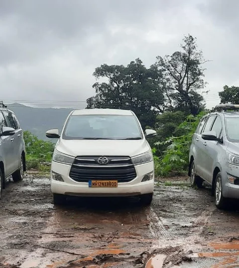 White Toyota Innova Crysta taxi with yellow MH number plate from Go India Taxi fleet, Mumbai and Pune