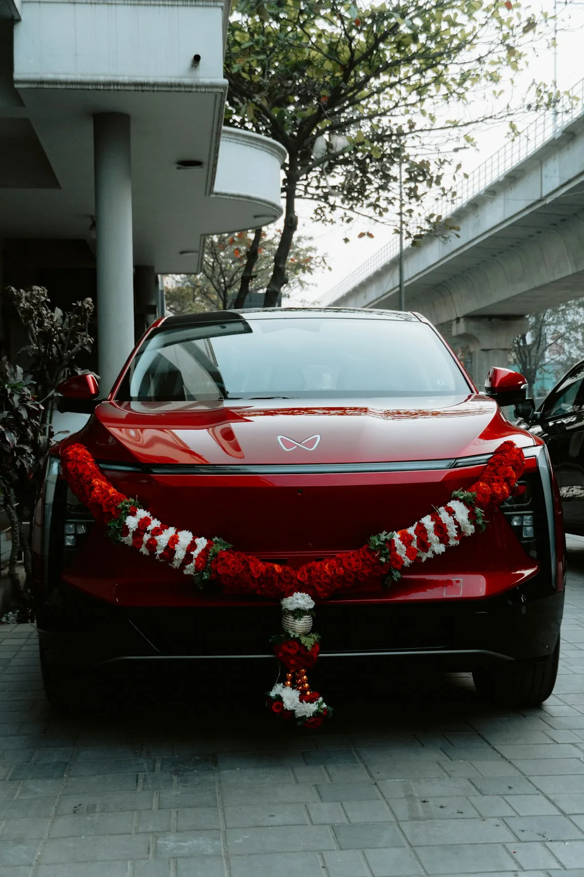 Car decorated with traditional garlands for an Indian wedding