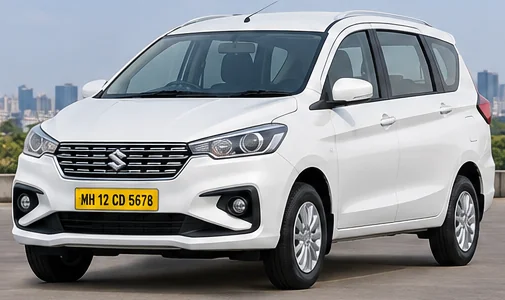 White Maruti Suzuki Ertiga taxi with yellow MH commercial number plate, Mumbai